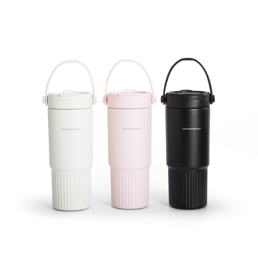 Three insulated travel mugs in white, pink, and black on a white background