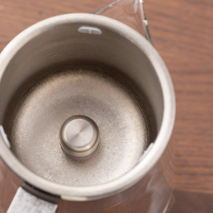 Flowing | Titanium and glass one-touch-teapot