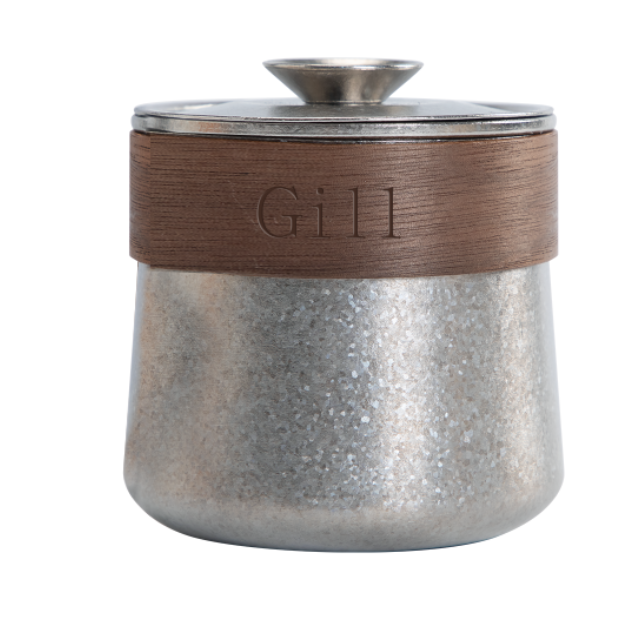Silver teapot with a brown wooden lid and custom name on it 