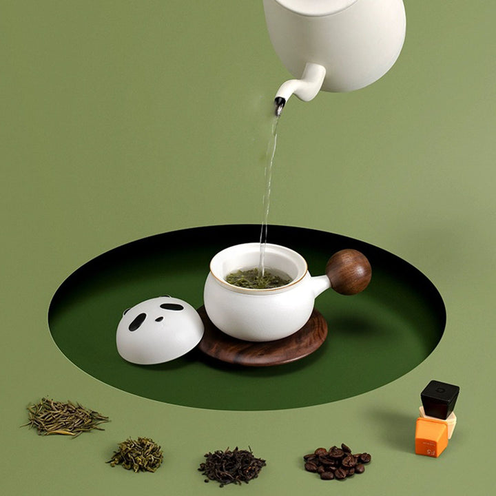 Ceramic tea mug with infuser and wooden saucer