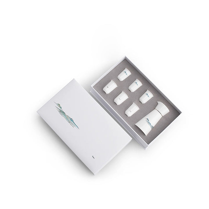 Set of Japanese sake bottles in a box on a white background