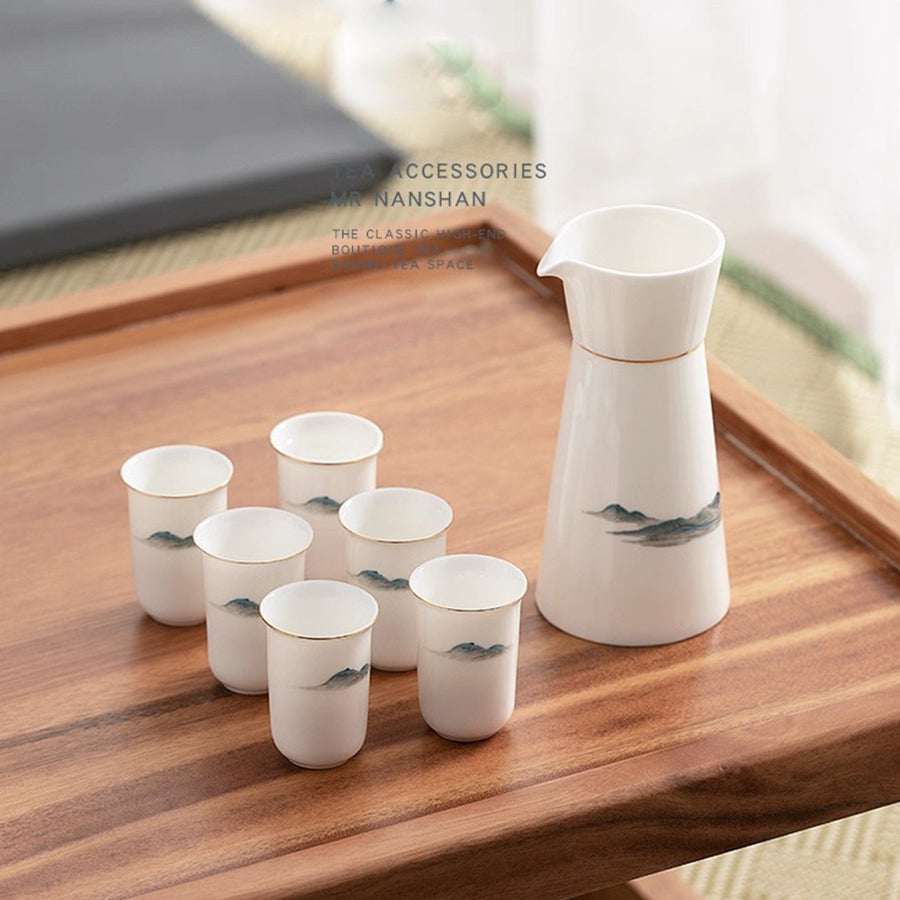 Ceramic sake and cups set on a wooden tray with custom name