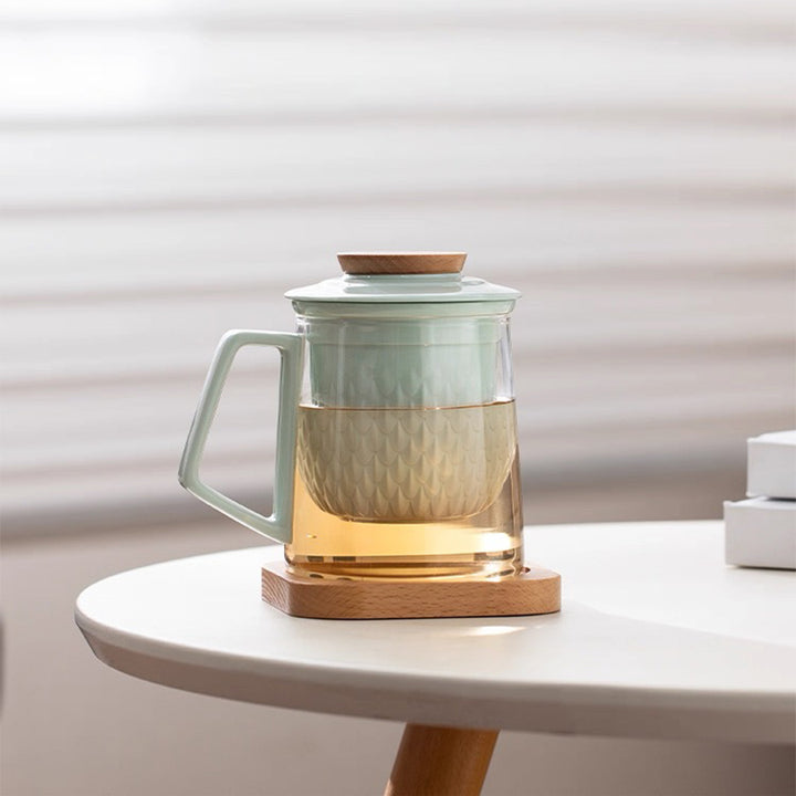 blue glass tea infuser mug with saucer and lid