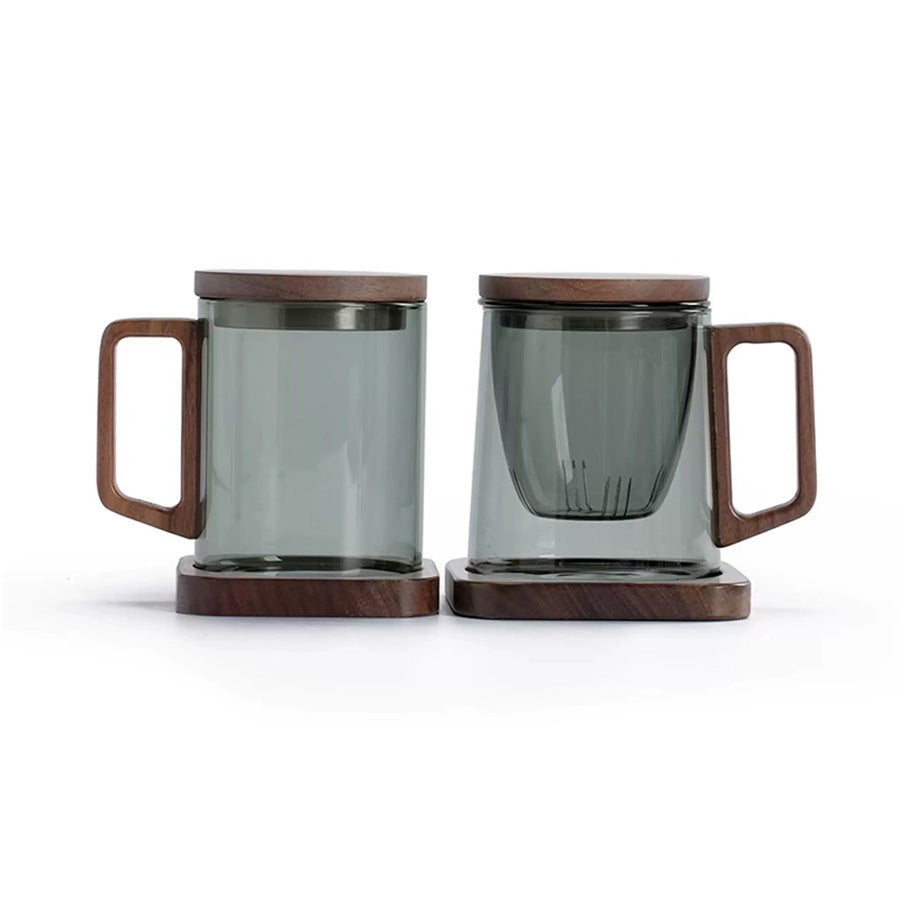 Two glass mugs with wooden handles and bases on a white background