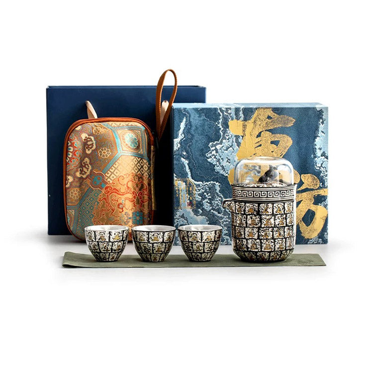 Artisan & Heritage tea set with ornate teapot, cups, and a box on a white background