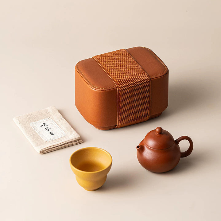 zisha teapot with yellow clay cup and a leather case 